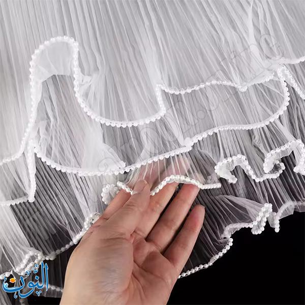 قماش تول مزخرف بحواف لؤلؤية